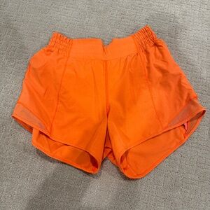 Orange Lululemon Highwaisted Hotty Hot Shorts